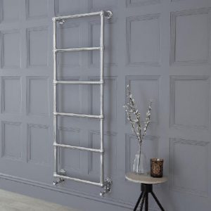 a traditional heated towel radiator on a wall