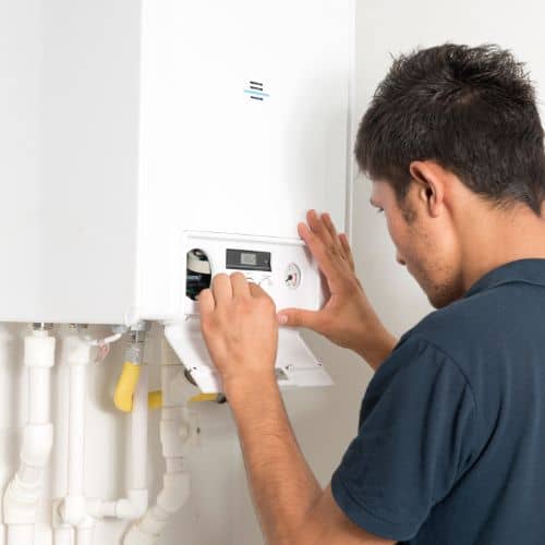 plumber fixing a boiler