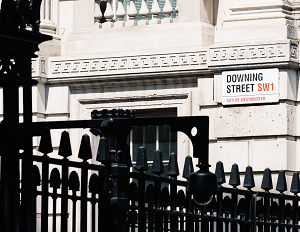 downing street street sign a street sign showing the name of Downing street in London