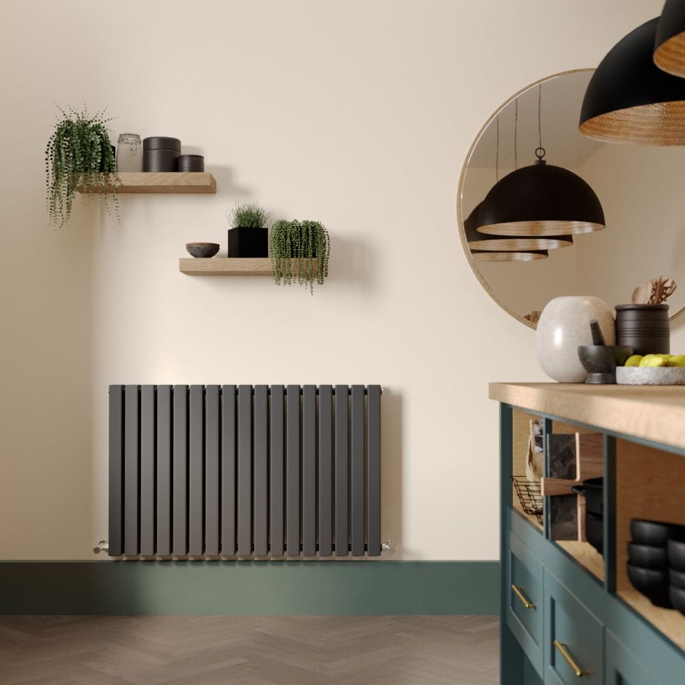 Milano Capri anthracite horizontal designer radiator on light wall beneath shelves and nearby large mirror and modern countertop