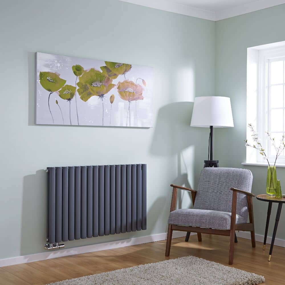 anthracite horizontal radiator on a blue living room wall