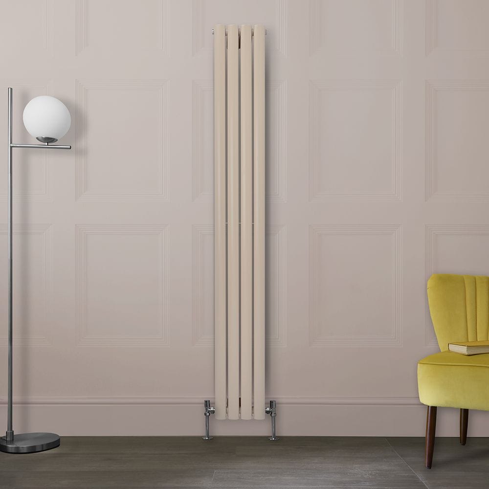Milano Aruba rose petal pink vertical radiator on white wall near lemon chair and tall freestanding lamp