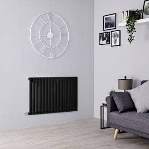 electric milano aruba radiator in a grey living room
