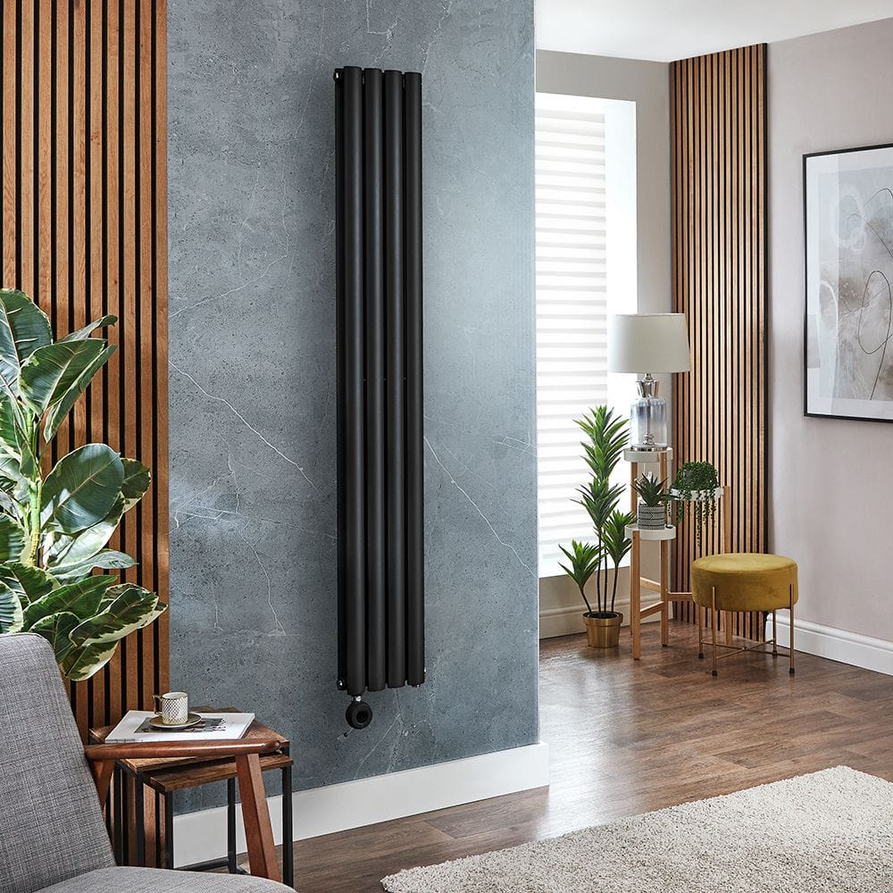 Milano x ECOSO Aruba electric black vertical designer radiator on blue/grey wall in modern living space