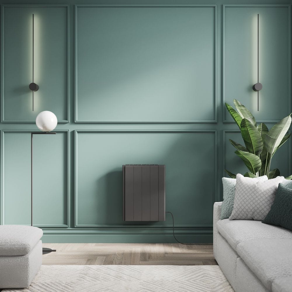 ECOSO Tuc anthracite ceramic core plug-in smart electric heater ECOSO Tuc anthracite ceramic core plug-in smart electric heater on green wall next to plant and settee