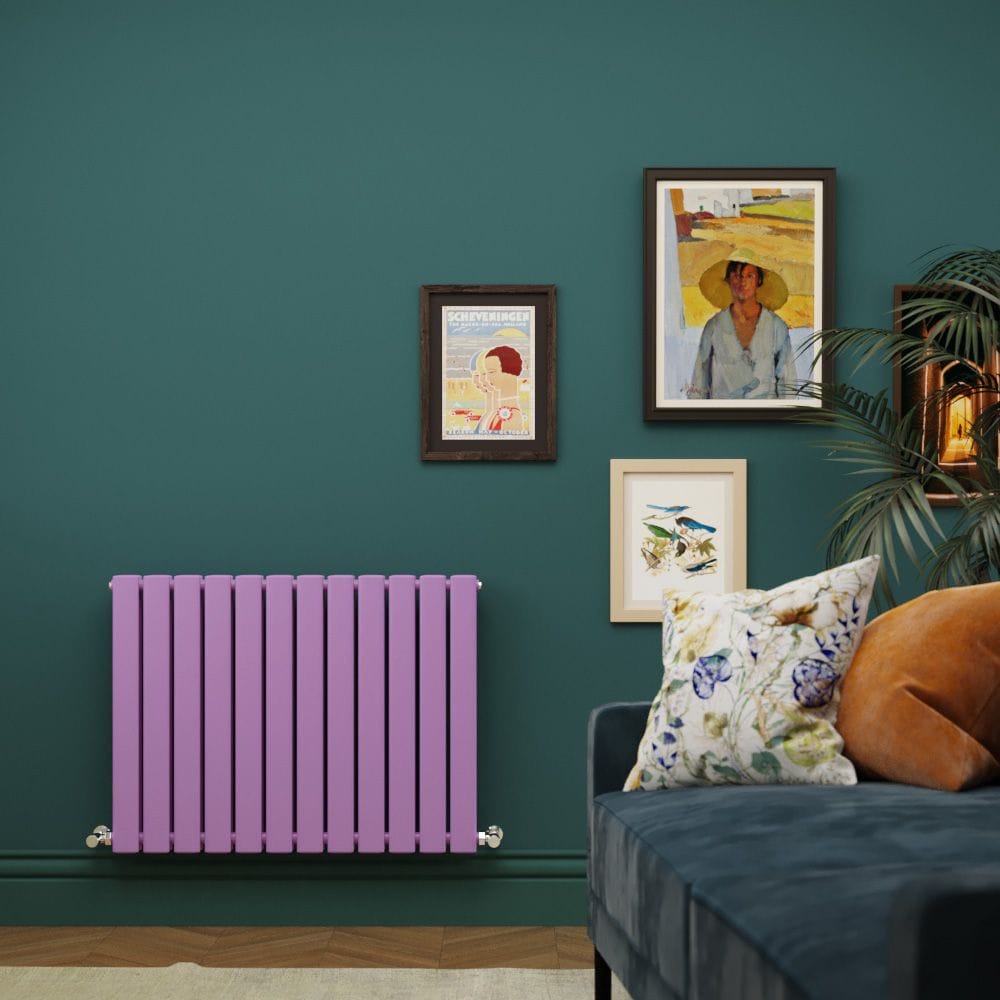 Milano Alpha lush purple horizontal flat double panel designer radiator on dark green wall nearby multiple pictures and dark blue settee