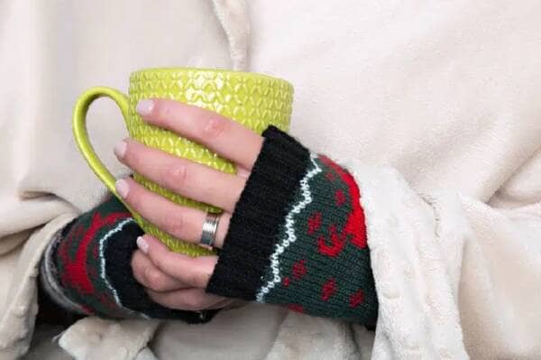 Woman holding hot drink