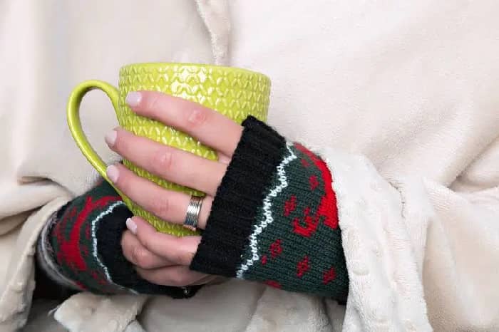 Woman holding hot drink