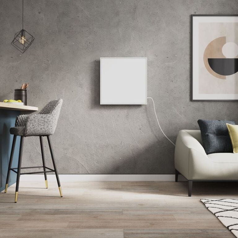 Milano Far white framed plug in smart electric infrared panel heater on grey wall in modern interior near countertop with grey chair and cream settee beneath artwork