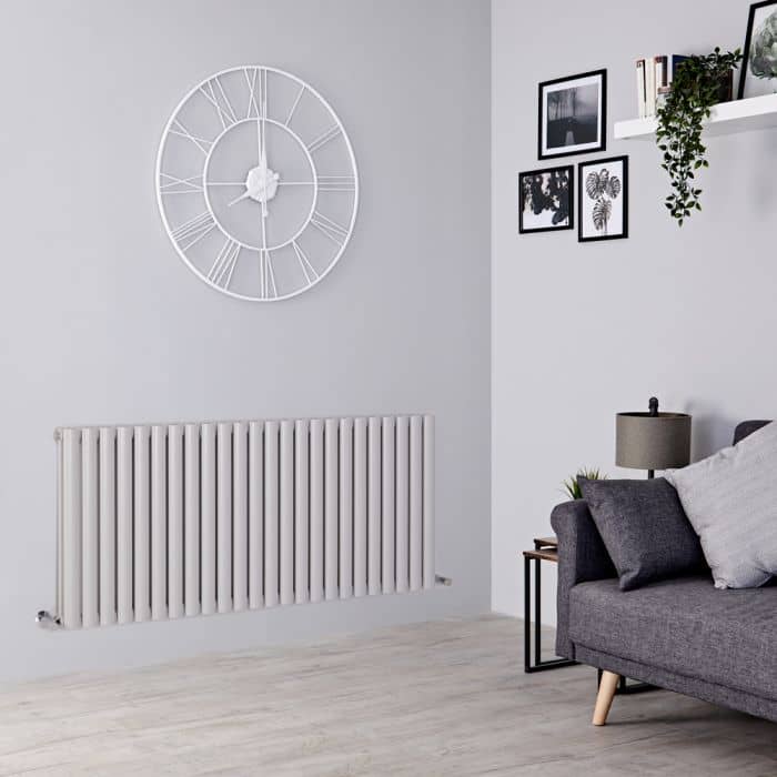 light grey radiator on a grey wall light grey radiator on a grey wall