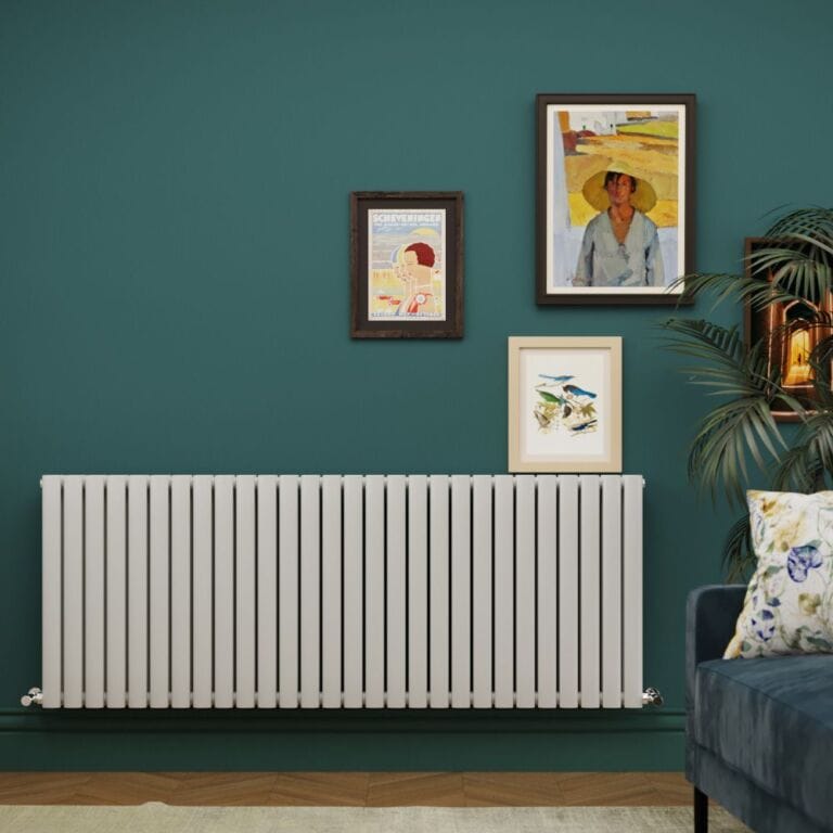 Milano Aruba light grey horizontal designer radiator on green wall beneath framed artwork in modern setting