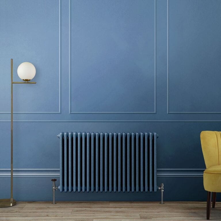 Milano Windsor blue horizontal traditional radiator on blue wall nearby tall lamp and yellow chair
