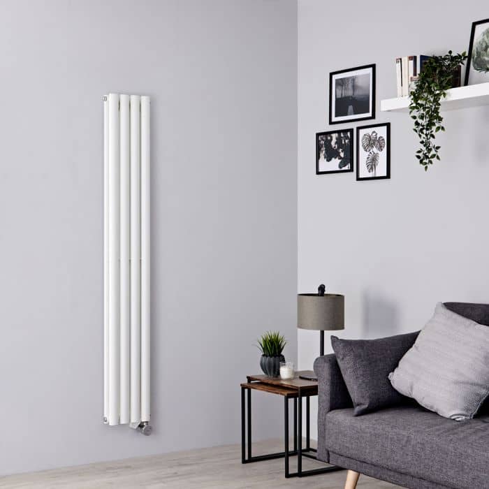 white vertical electric radiator in a grey living room