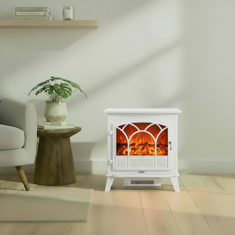 ECOSO Emberton white traditional electric stove nearby houseplant on small table beneath shelf with books and candle