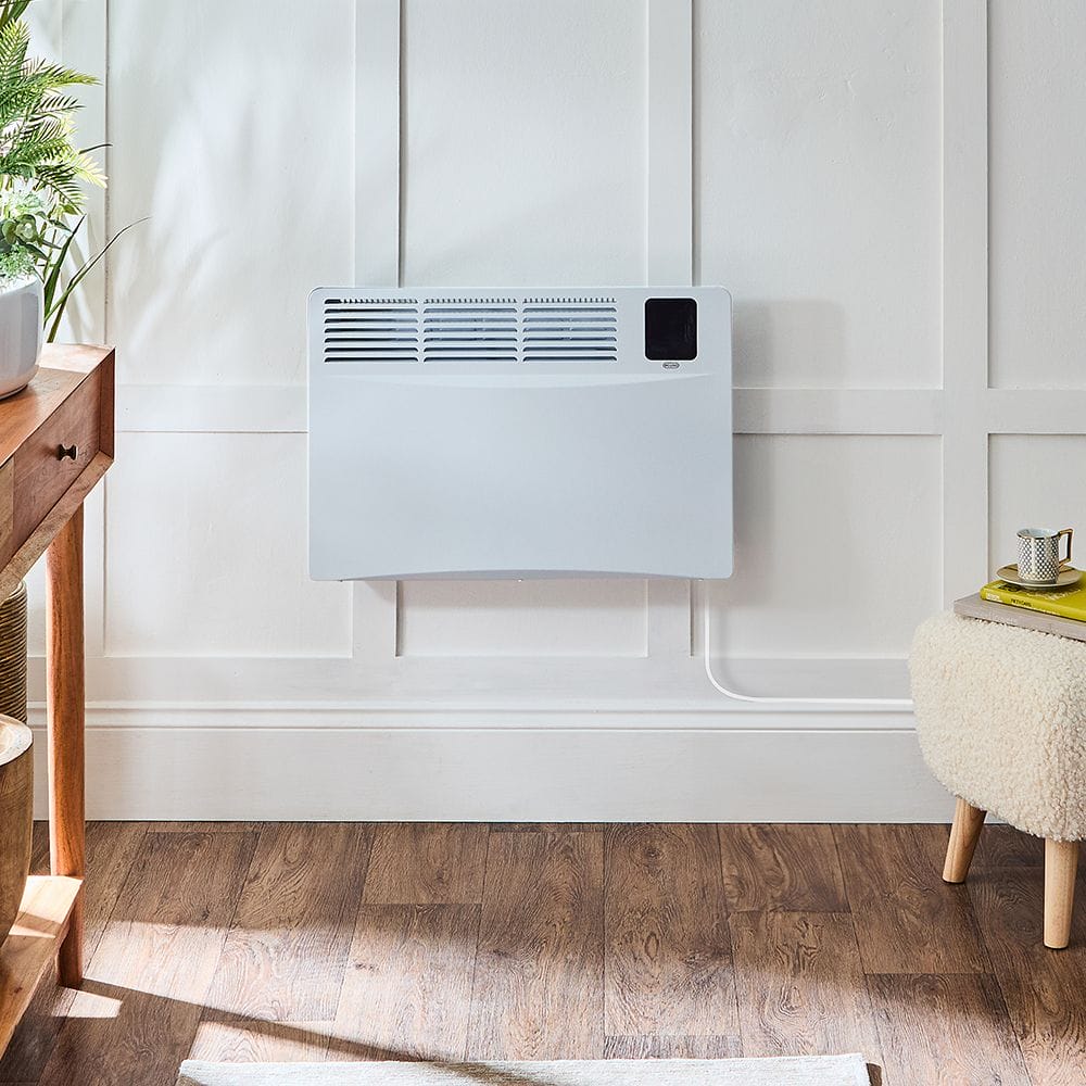 ECOSO Elio white smart electric plug in convector panel heater on white wall above hardwood flooring