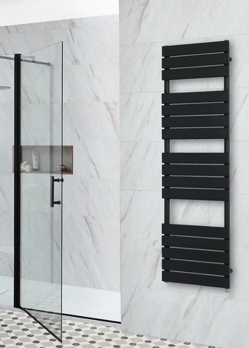 a black electric milano lustro heated towel rail in a modern bathroom