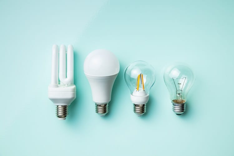 Energy saving and classic light bulbs on colorful background. Top view. Energy saving and classic light bulbs on colorful background. Top view.