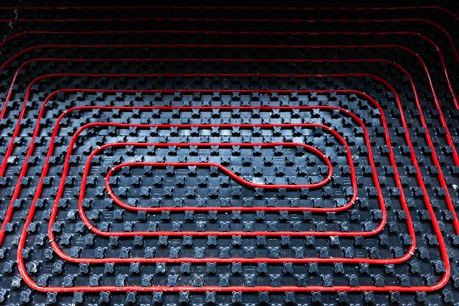 Underfloor heating installation with wiring and pipework