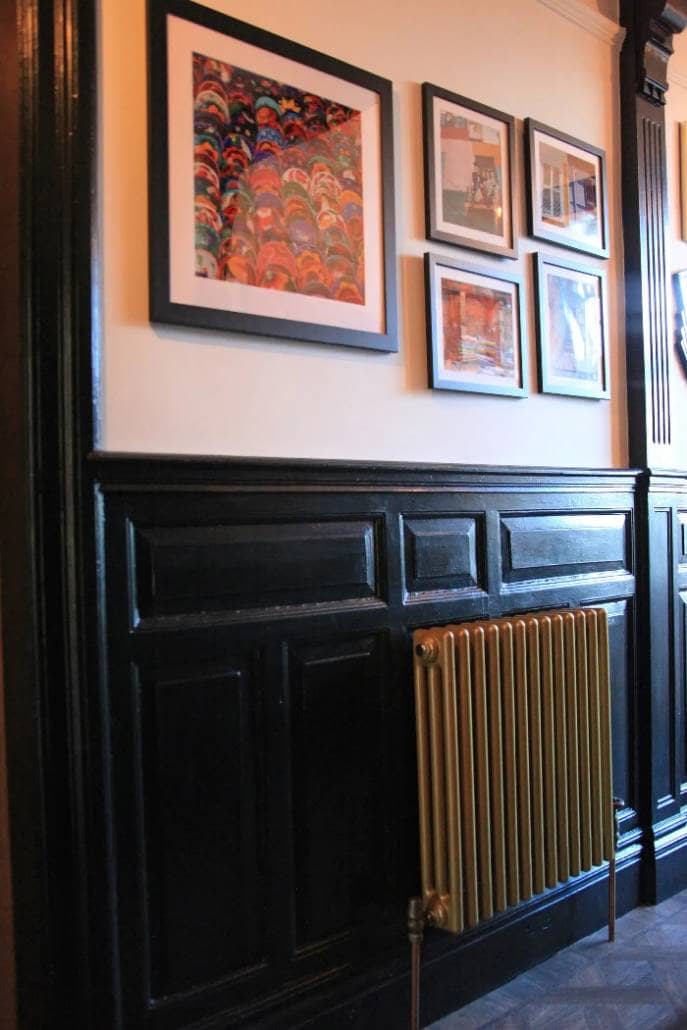 Fresh Start Living - Dark hallway 4 gold column radiator in a dark hallway