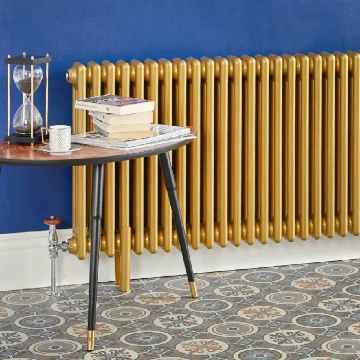 gold radiator on a blue wall