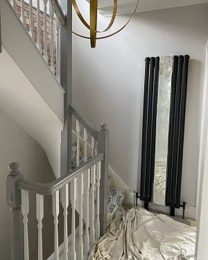 customer submitted image of mirrored radiator in home