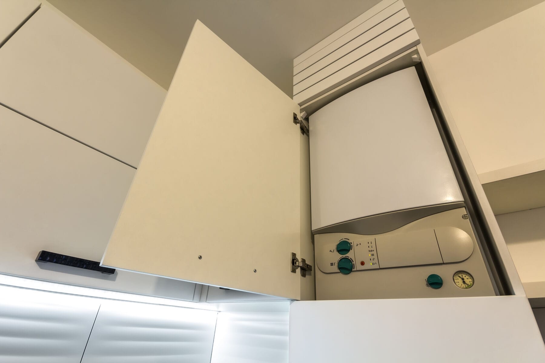 Boiler in white open cupboard Boiler in white open cupboard