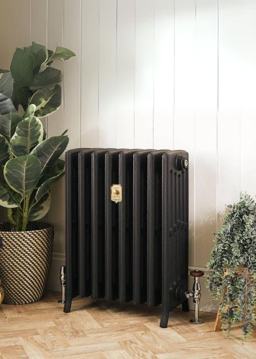 a cast iron radiator in a room with high ceilings