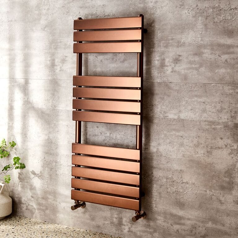 Milano Lustro designer brushed copper flat panel heated towel rail on grey wall