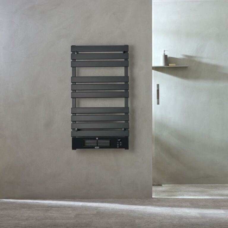 ECOSO Linus anthracite smart electric heated towel rail with fan on stone grey wall in modern bathroom interior