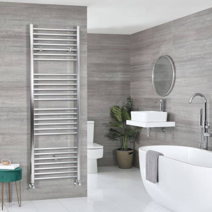 Large ladder style Milano Kent heated towel rail in a bathroom