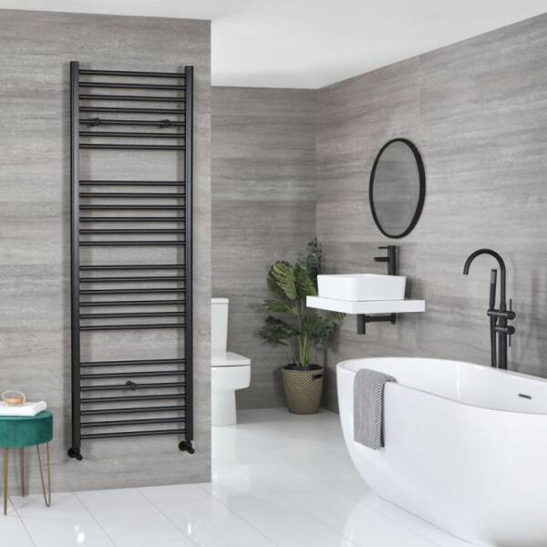 Milano Nero black heated towel rail Milano Nero black heated towel rail in modern bathroom near bath and mirror