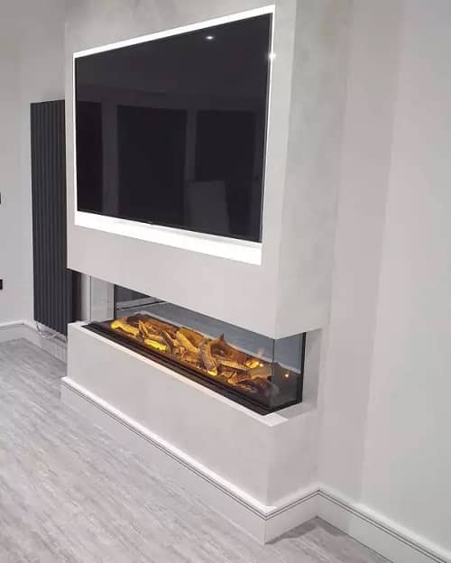 the fireplace and radiator in the open plan living space