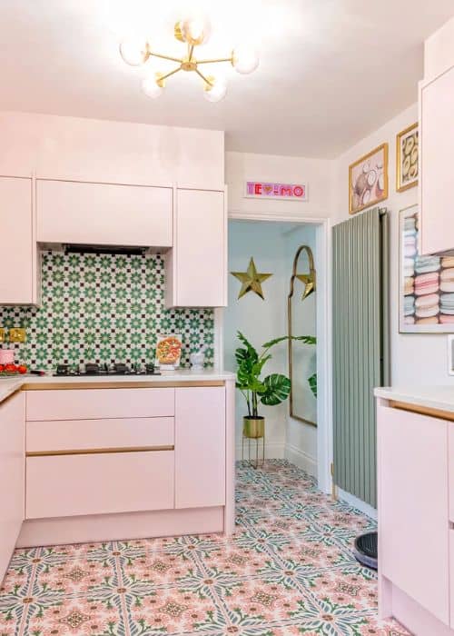 sage green vertical radiator in a pink kitchen