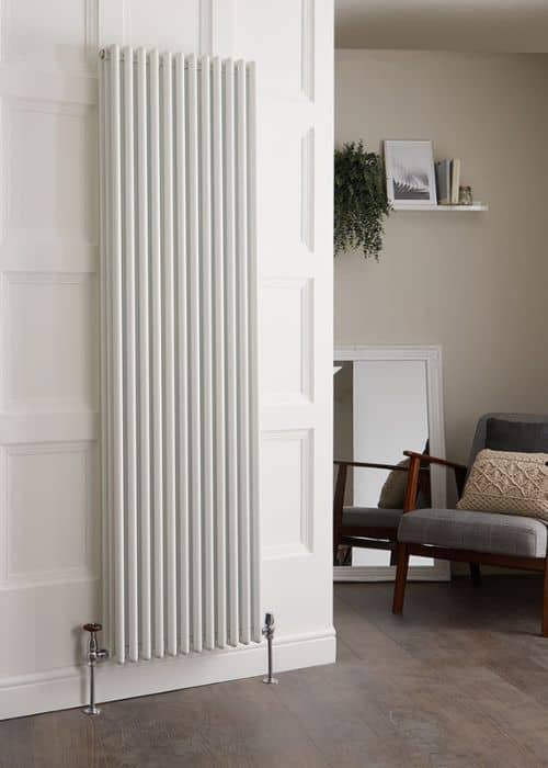 vertical white column aluminium radiator in a kitchen