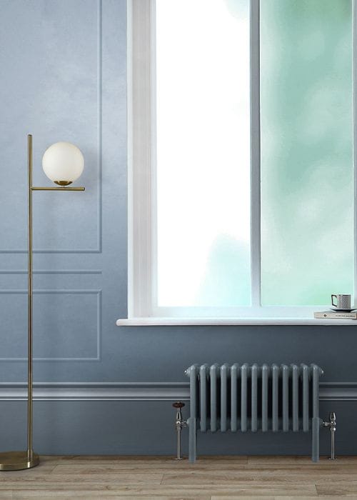 light blue low level radiator under a window