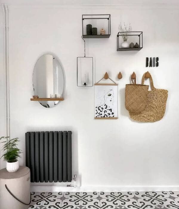 A Milano Aruba anthracite radiator on a white wall.