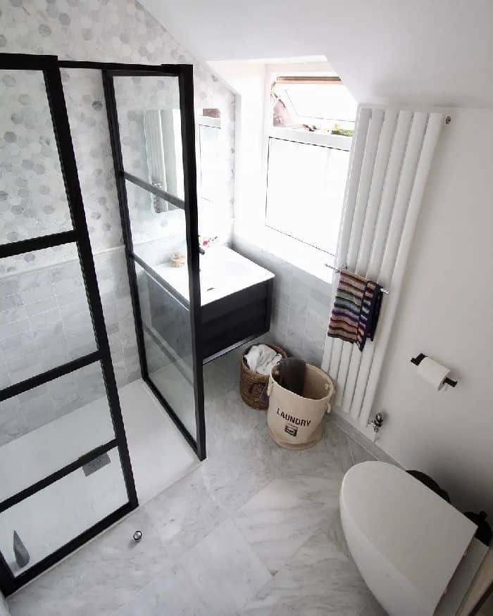 narrow vertical radiator in a small bathroom from above