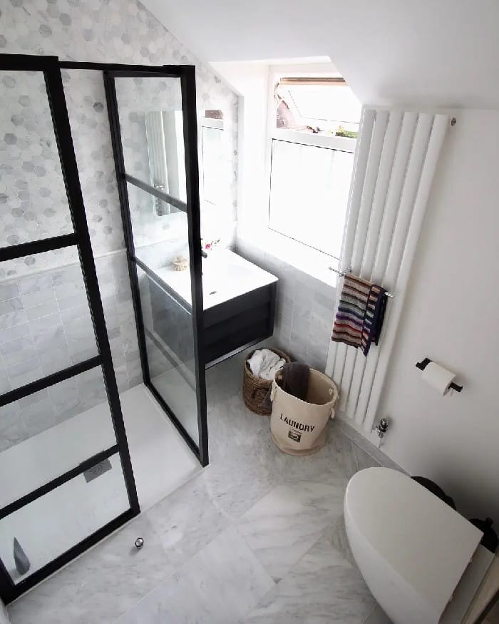 narrow vertical radiator in a small bathroom from above narrow vertical radiator in a small bathroom from above
