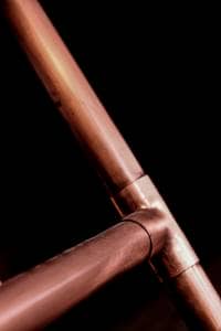Copper heating pipework Close up shot of copper heating pipe connection