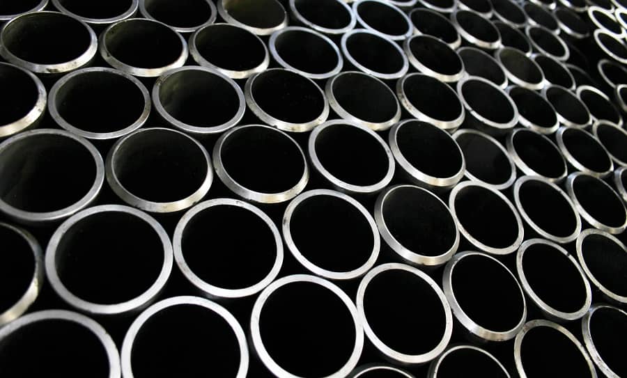 Close up image of stack of silver metal pipes