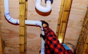 Plumber setting up single pipe loop heating system