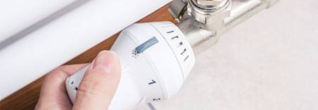 hand turning a radiator off