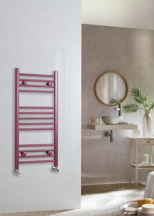 red milano ive heated towel rail in a modern bathroom