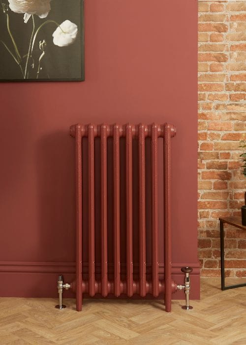 red milano mercury cast iron radiator in a red hallway