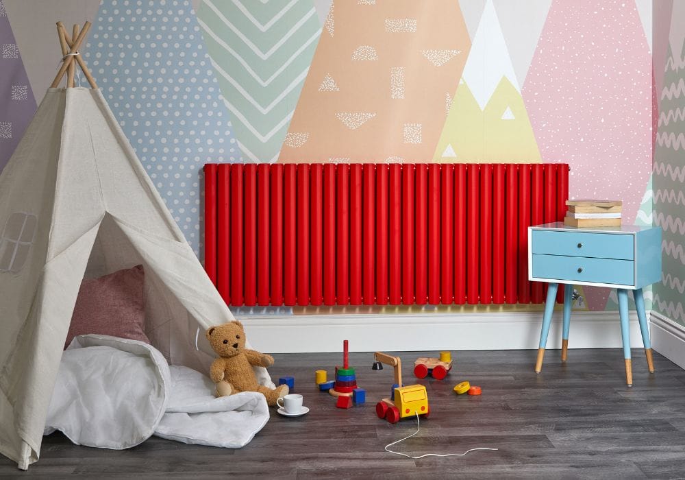 red aruba radiator in a colourful playroom