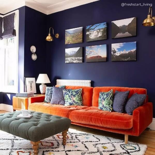 2 Red settee in blue living room