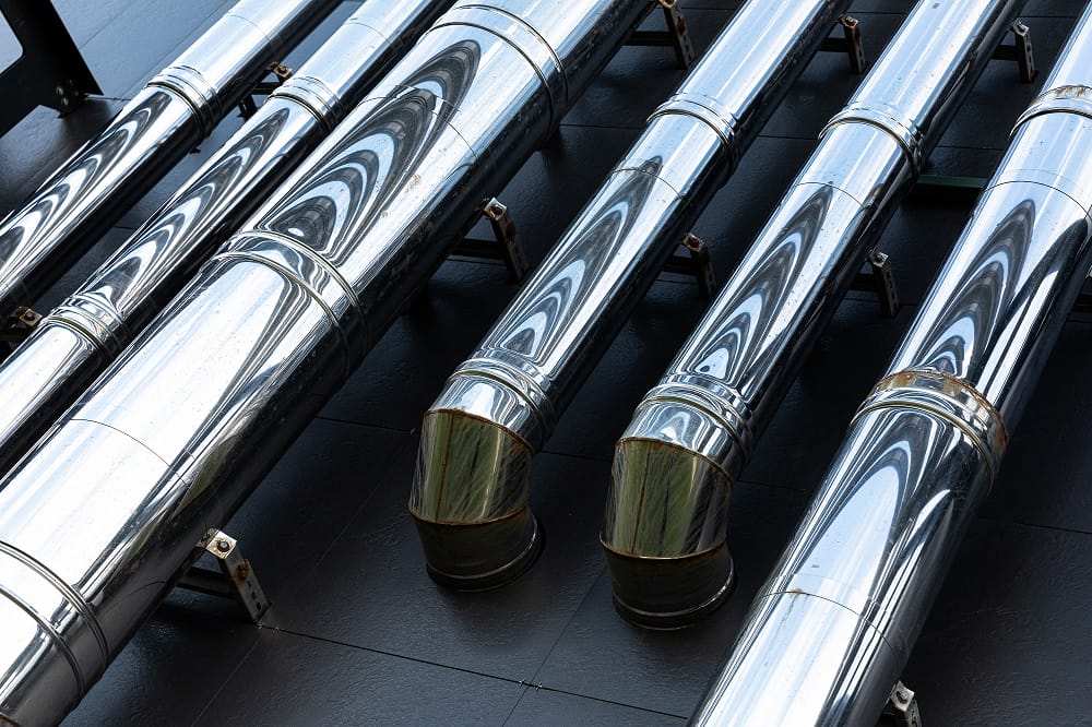 Stainless steel pipes on wall