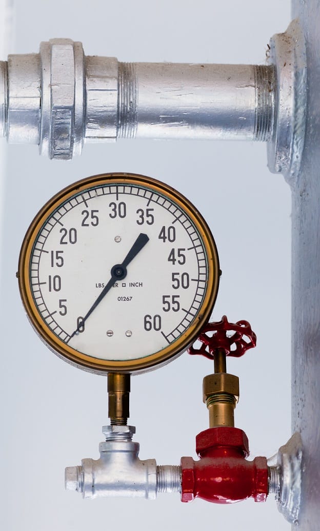 Metal pressure gauge on boiler tank Metal pressure gauge on boiler tank