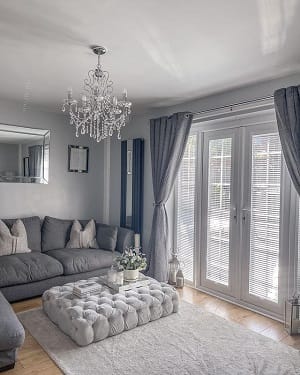 customer submitted image of mirrored vertical radiator fitted to wall in spacious traditional living room customer submitted image of mirrored vertical radiator fitted to wall in spacious traditional living room