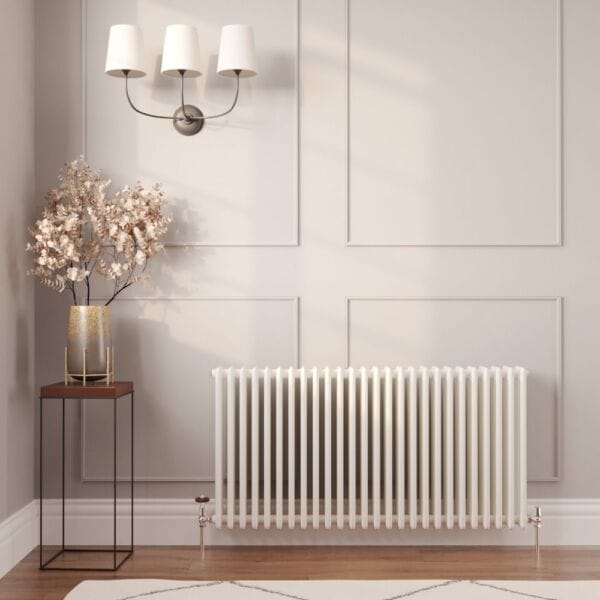 Milano Windsor white traditional horizontal radiator on white wall nearby vase and triple lamp